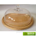 Clear glass bell dome with wooden base